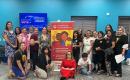 Group of women gathered in front of a MamasConPoder sign at a Nevada Moms Vote meeting in Sept. 2024