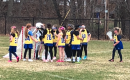 Photo of a group of young field hockey players
