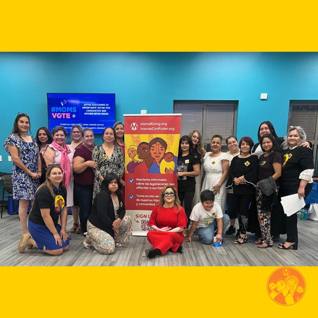 Group of women gathered in front of a MamasConPoder sign at a Nevada Moms Vote meeting in Sept. 2024